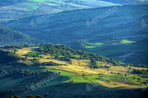 Preview: Beautiful scenery of a green mountainous landscape in the early morning