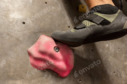 Preview: foot of man exercising at indoor climbing gym