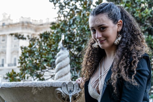 Preview: Shallow focus closeup of a female standing near a fountain