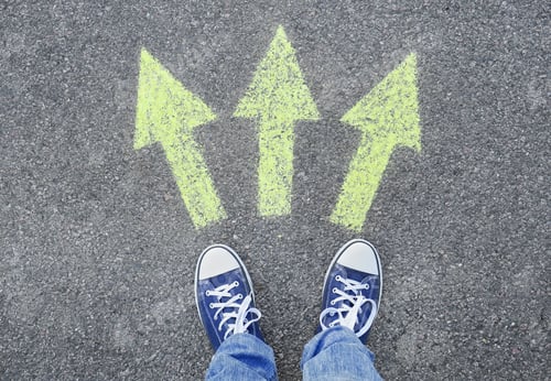 Preview: Man standing on road near arrows marking, closeup