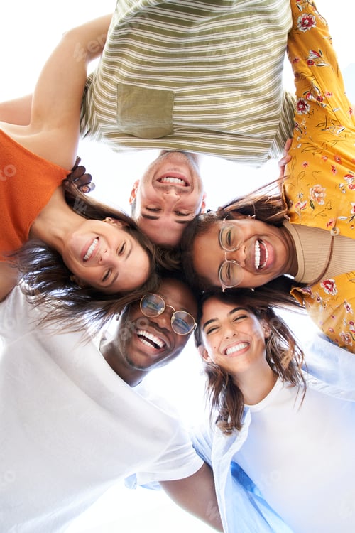 Preview: Vertical multiracial group young people standing in circle smiling at camera. Concept youth culture.