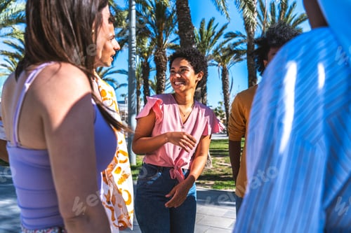 Preview: Multiethnic group of young happy friends hanging out