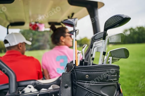 Preview: Two Caucasian people sitting in a vehicle