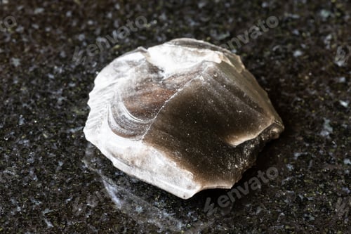 Preview: sample of raw obsidian rock on black