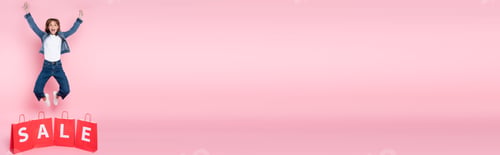 Preview: Panoramic image of excited woman jumping near shopping bags with sale lettering on pink background