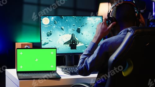 Preview: Isolated screen notebook near gamer using crosshair to hit targets
