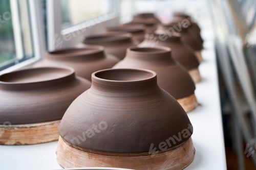 Preview: Manufacture of ceramic products, workpiece. Close up background with ceramic pieces. Soft focus
