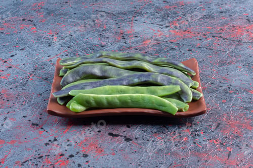 Preview: Bundle of bean pulses on a platter on dark colored background