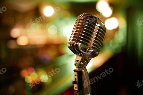 Preview: Shiny Chrome Mic in Vintage Style against Blurred Lights in Jazz Club