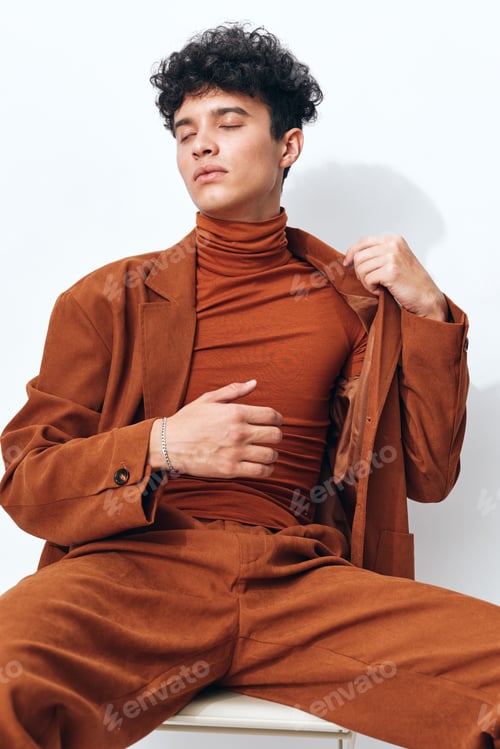 Preview: Hipster man fashion student portrait beige thoughtful sitting