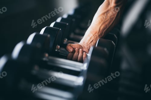 Preview: Rows of dumbbells in the gym with hand