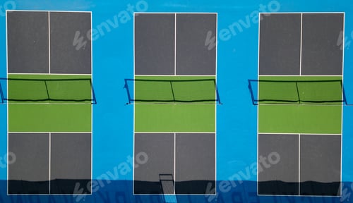 Preview: Top-down aerial drone view of pickleball courts with vibrant blue and green colors, showing