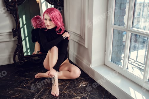 Preview: Lovely young woman posing in photo studio