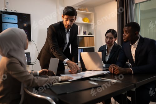 Preview: Multiethnic group of business people working together in a modern office
