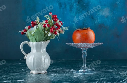Preview: Tasty ripe persimmon on glass plate with vase of flowers