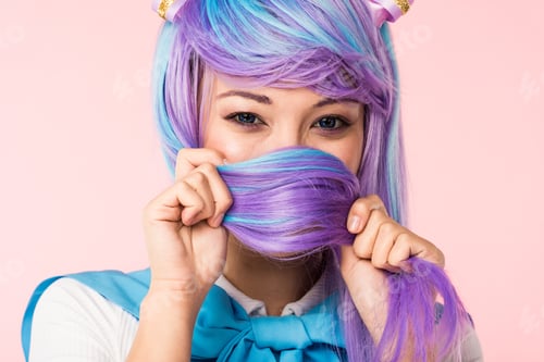 Preview: Asian anime girl covering face with hair isolated on pink