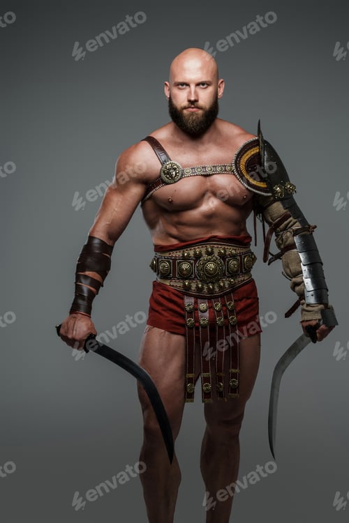 Preview: Bald and bearded gladiator poses standing tall with two swords