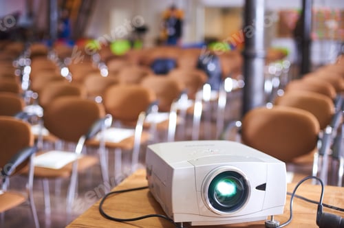 Preview: Working projector at the empty conference hall
