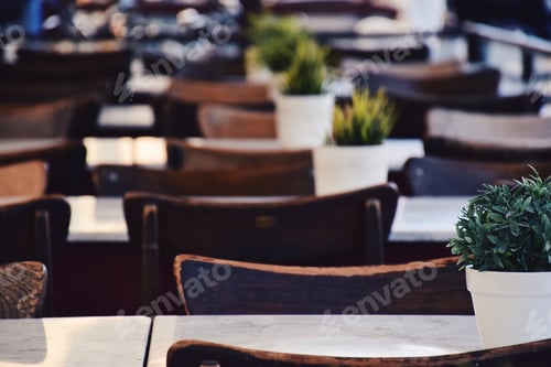Preview: Empty chairs and tables in an outdoor cafe or restaurant