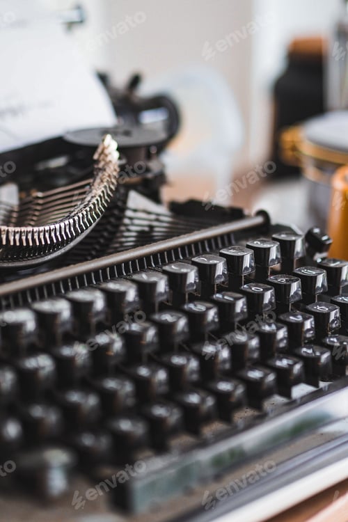 Preview: Vertical shot of a black typewriter