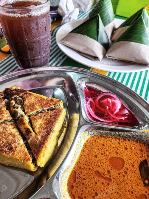 Preview: Murtabak. Folded pan-fried flatbreads, stuffed with lightly spiced mince meat and egg.