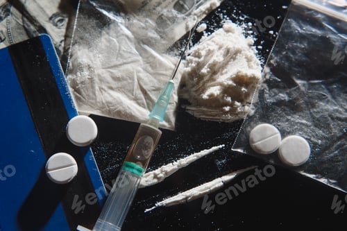 Preview: Hard drugs on dark table.