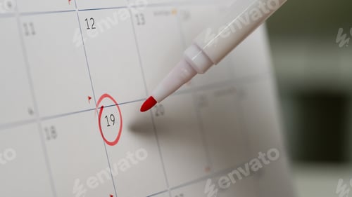 Preview: Close-up of calendar page with red circle around date 19 and red marker