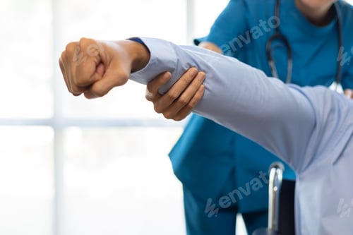 Preview: Physiotherapist, female doctor practicing physiotherapy for rehabilitation of patients at hospital.
