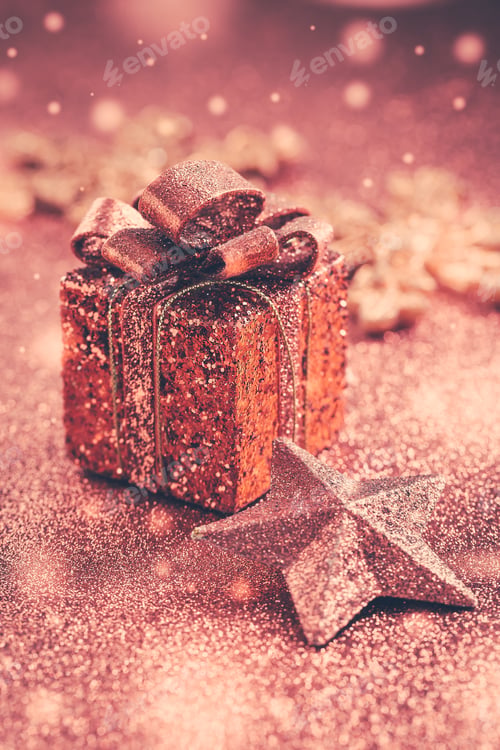 Preview: Christmas Present with ornaments and balls. Blurry glitter background.