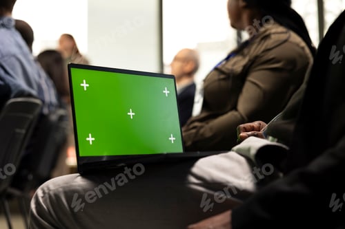 Preview: Green screen laptop during debate in conference room with chairs