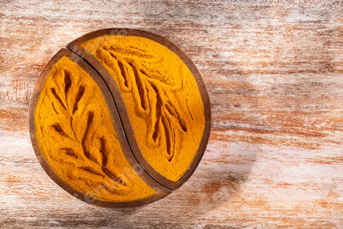 Preview: Turmeric powder in bowl on wooden background