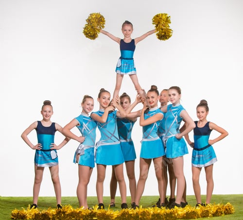 Preview: The Group Of Teen Cheerleaders Posing At White Studio