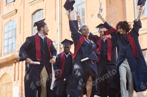 Preview: Happy graduated students in robes