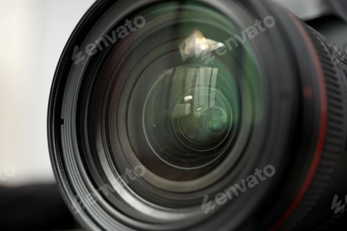 Preview: Lens on the background of the process shooting, on a light background.