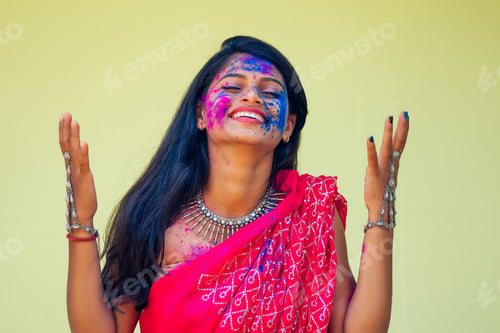 Preview: Holi Festival Of Colours. Portrait of happy indian girl in traditional hindu sari on holi color .