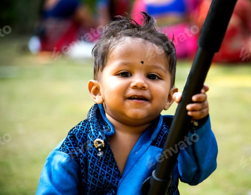 Preview: The one year old cute boy play in garden