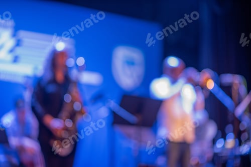 Preview: Blurred image of musicians performing at festival
