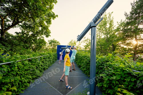 Preview: Kids at observatory looking in telescope outdoor.