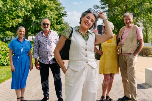 Preview: Group of senior friends meeting outddors in the city and having fun
