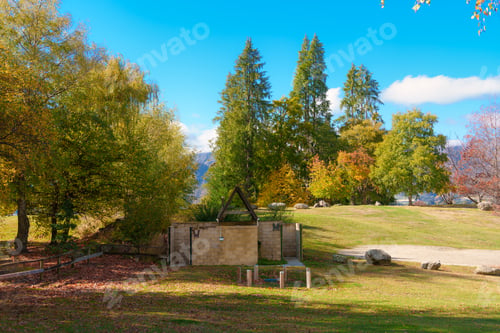 Preview: Public restroom surrounded by colorful autumn park and green space