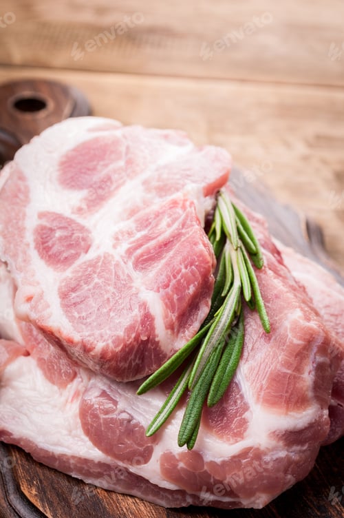 Preview: Fresh Raw Pork with Rosemary on Wood