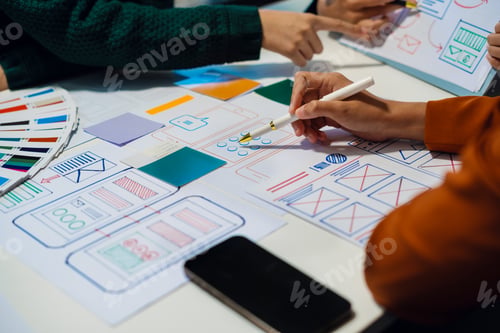 Preview: UX developer and ui designer brainstorming about mobile app interface wireframe design