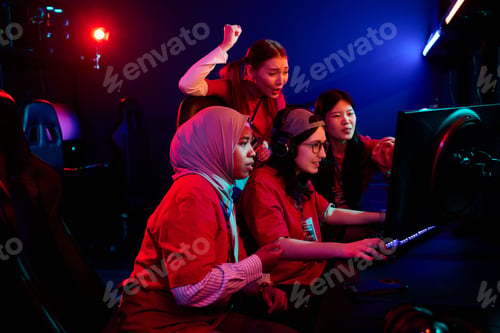Preview: Diverse Teen Girls Team Collaborating While Playing Video Game in Esports Arena