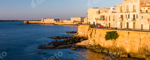 Preview: Panoramic photo of Ortigia at sunrise, with Ortigia Castle (Castello Maniace, Castle Maniace) in the