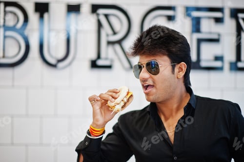 Preview: Indian man at fast food cafe