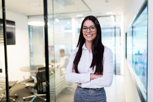 Preview: Portrait of young beautiful businesswoman in office