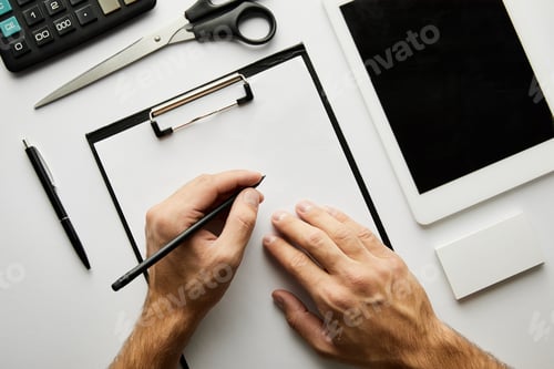 Preview: cropped view of man writing in clipboard with pen