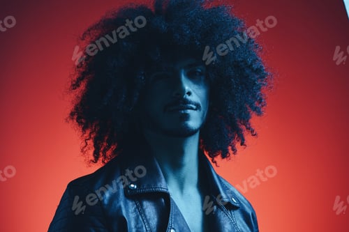 Preview: Portrait of fashion man with curly hair on red background multinational, colored light, black