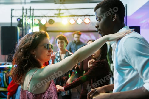 Preview: Passionate couple dancing at club party