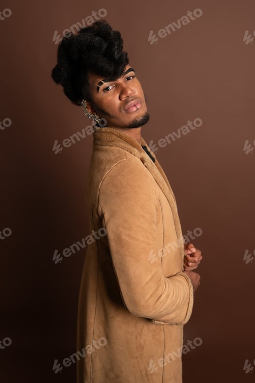 Preview: Stylish model posing in suede coat, embracing modern fashion trends
